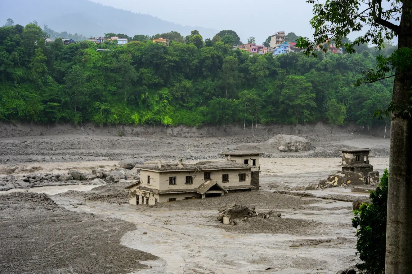 Homes surrounded by flood debris in Nepal.